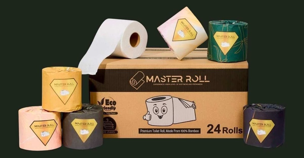 Master Roll bamboo toilet paper: the 24-roll box with its black and gold Master Roll band, an unwrapped white roll and six individually wrapped rolls in blush, green, ochre, pink, charcoal and navy papers with gold labels